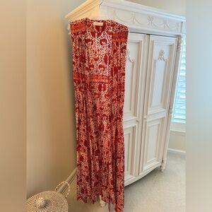 Elegant Natalie Martin red, orange, and white wrap dress.